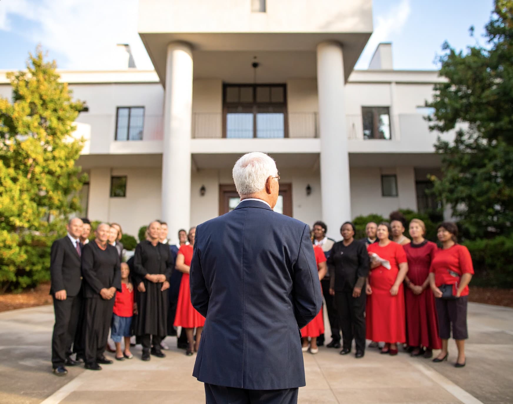 A driveway leading to a large estate, symbolizing business growth and success.